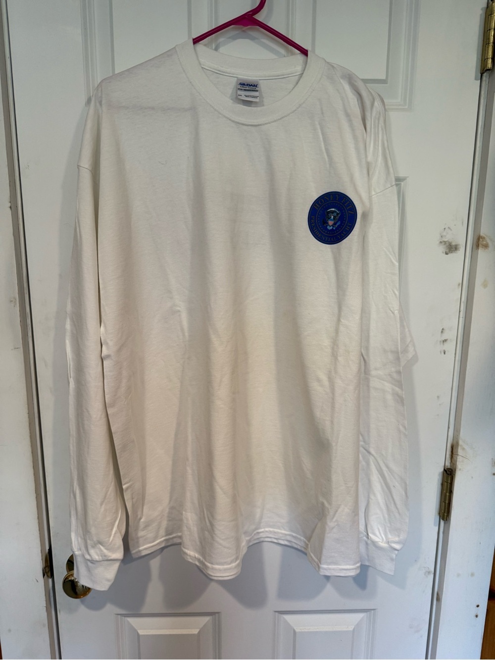Gildan White Long Sleeve Shirt with Small Blue Chest Emblem